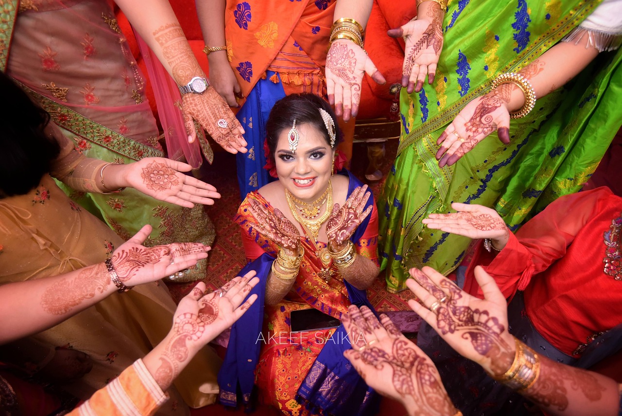 This picture shows a Bangladeshi women in a saree, getting ready for her wedding festivities